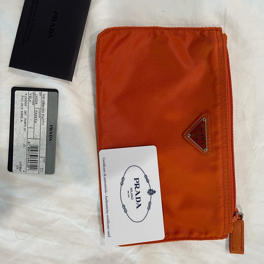 Prada orange pouch with authentication card